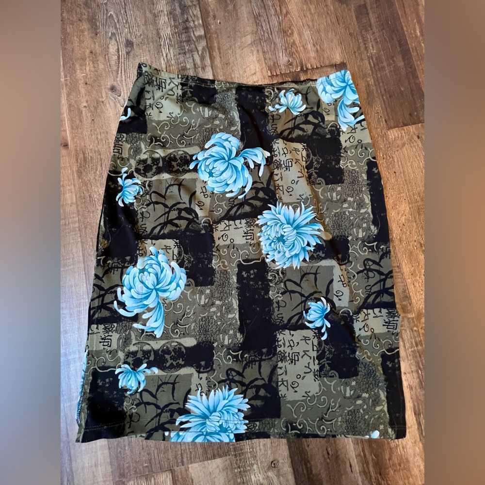 Skirt with small slit on either mid thigh area.  Super cute on!